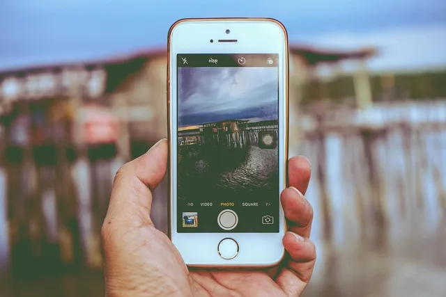 apple, hand, iphone, macro, mobile phone, screen, smartphone, taking photo. How to find micro influencers in the UK without an agency